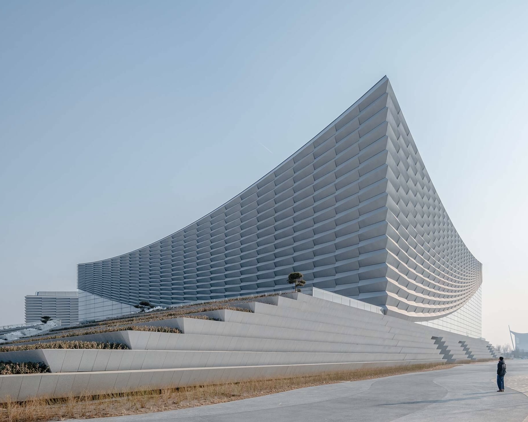 Perkins&Will and Schmidt Hammer Lassen deliver performing arts center in China with faceted aluminum facades